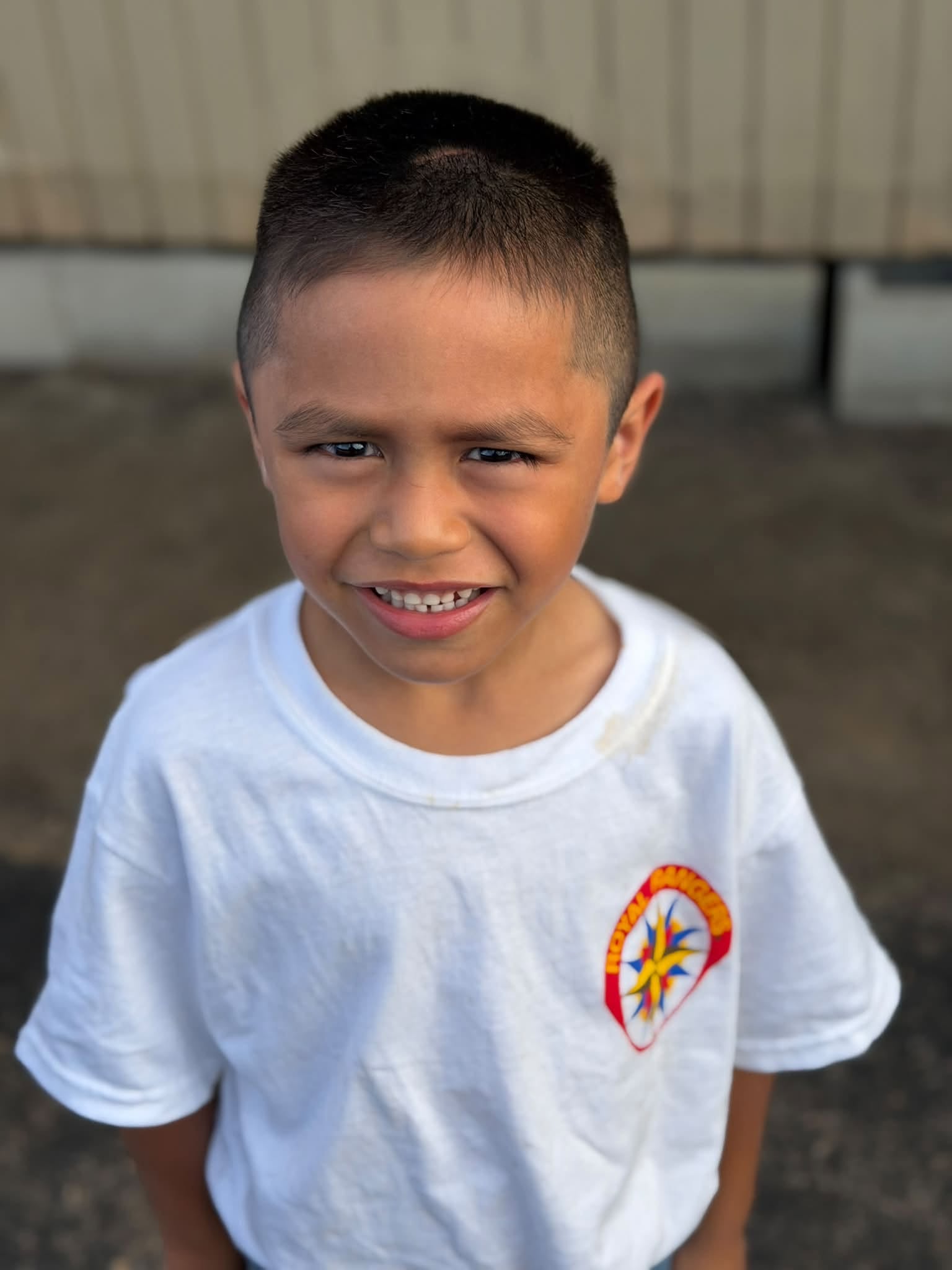 Boy wearing a Faith Center ministry shirt