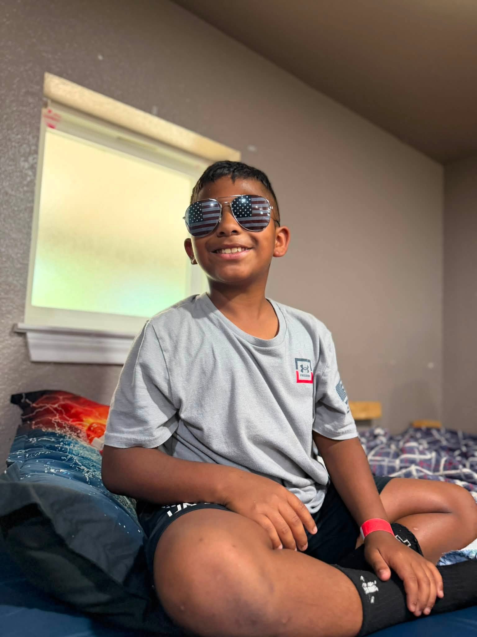 Boy smiling during a ministry gathering
