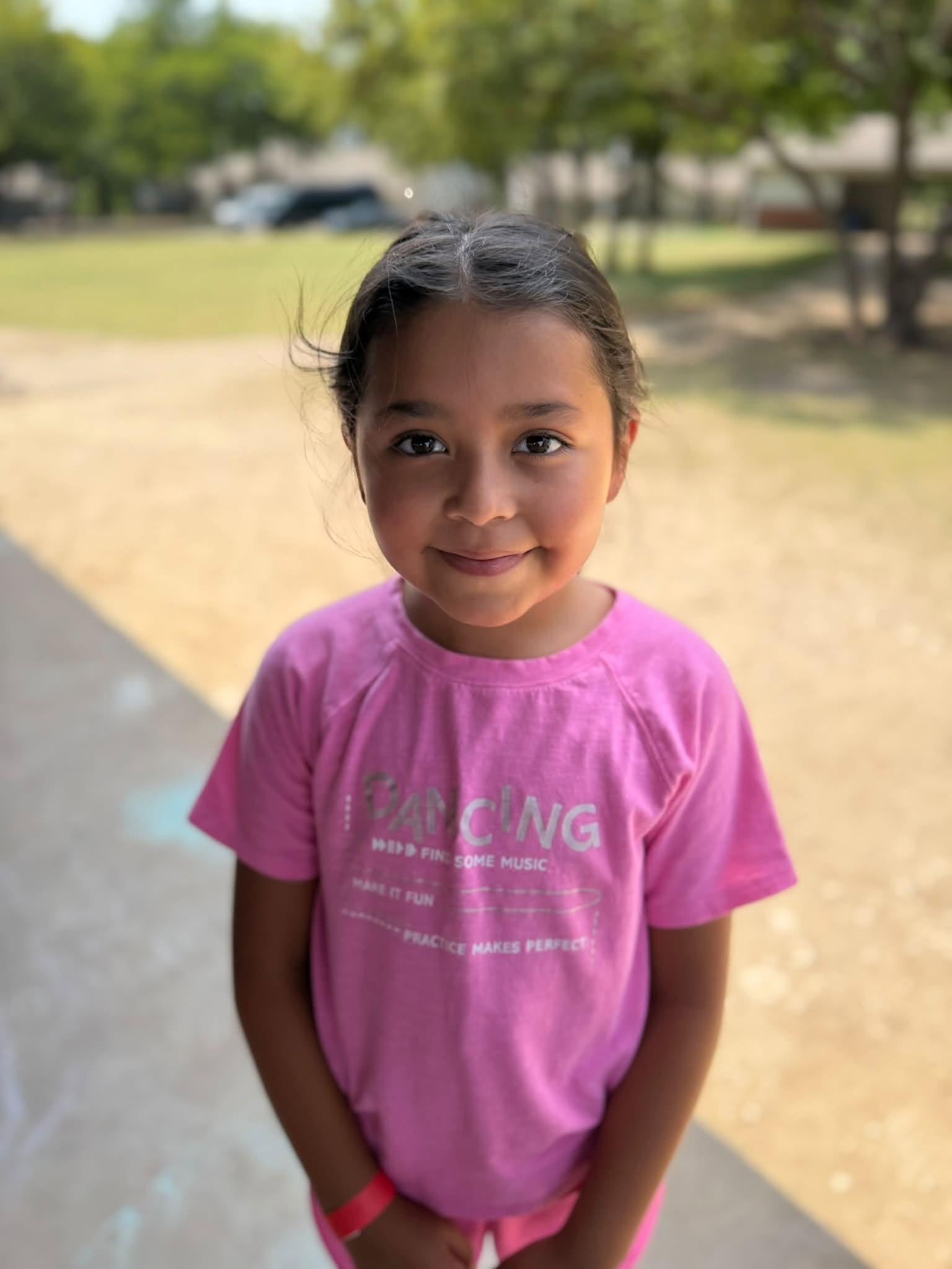 Girl smiling during an outdoor ministry activity