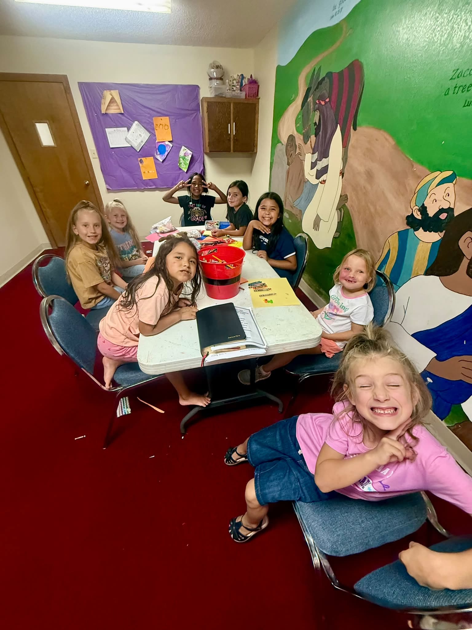 Girls Ministries group gathered around a table